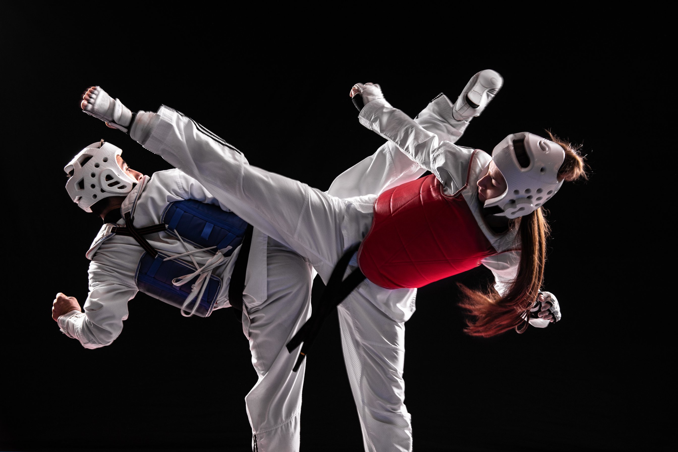 Man and woman taekwondo combat